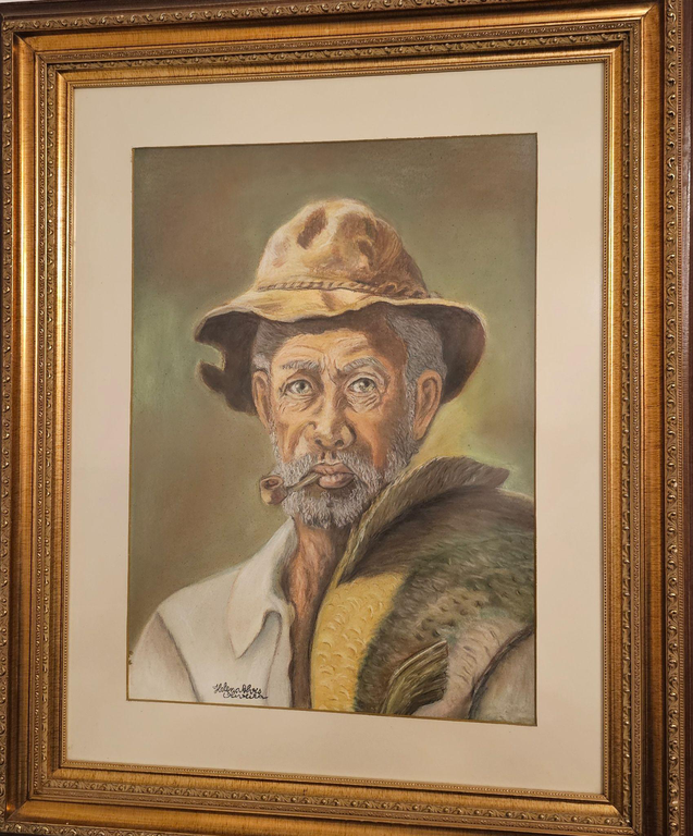 Preto Velho Pescador.png A imagem representa a obra da artista plástica Helena Oliveira intitulada de "Preto Velho Pescador". A obra mostra a figura de um homem negro, idoso, usando um chapéu de pescador, um cachimbo na boca e um peixe em seu ombro direito.